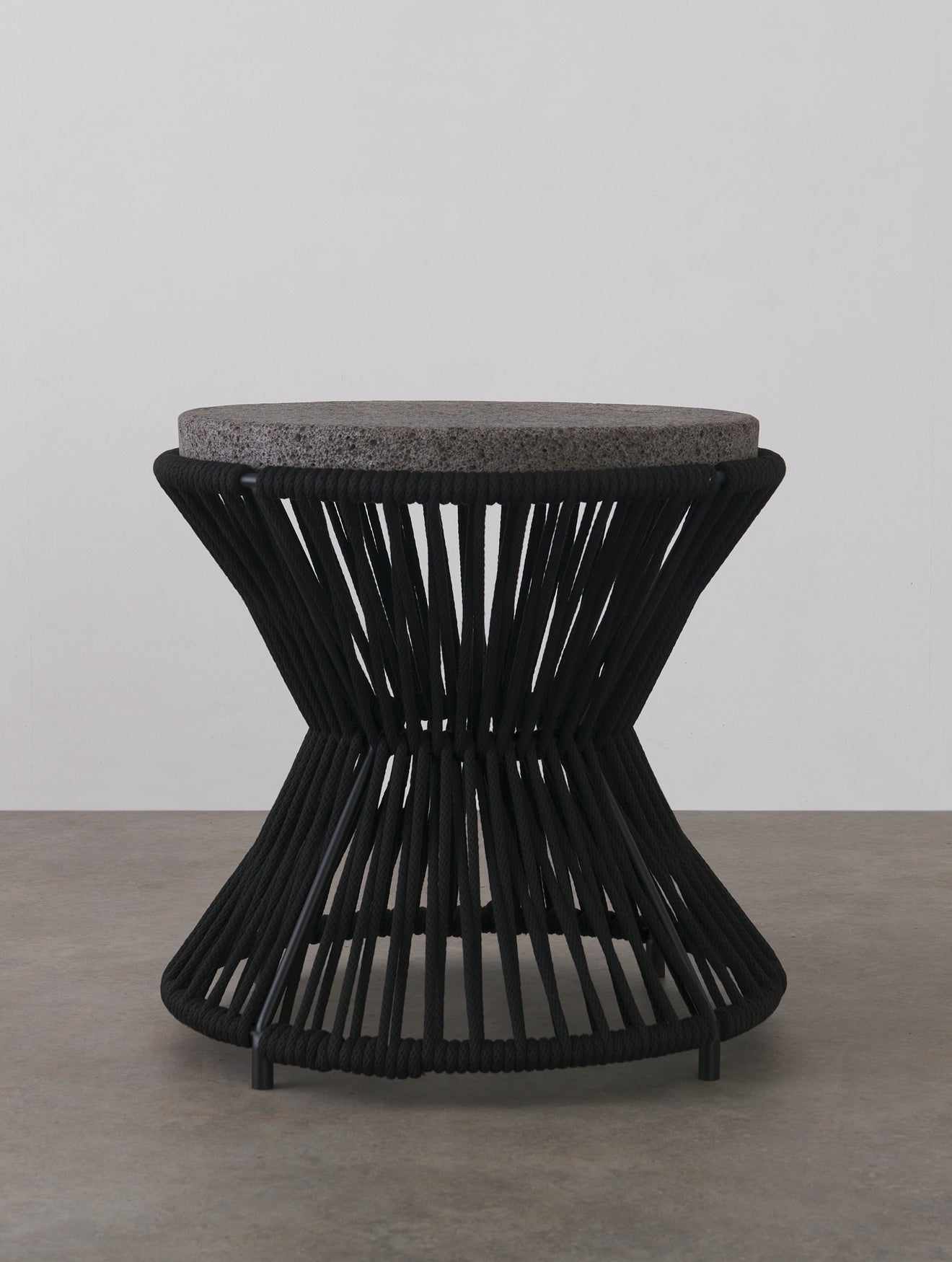 OUTDOOR ROUND TABLE WITH BASALT TOP BY LIKA MOORE